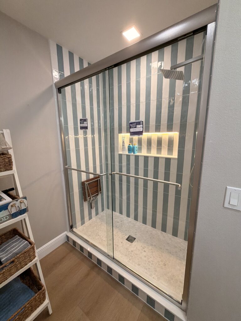 A complete shower remodeling project along with new vinyl plank flooring.